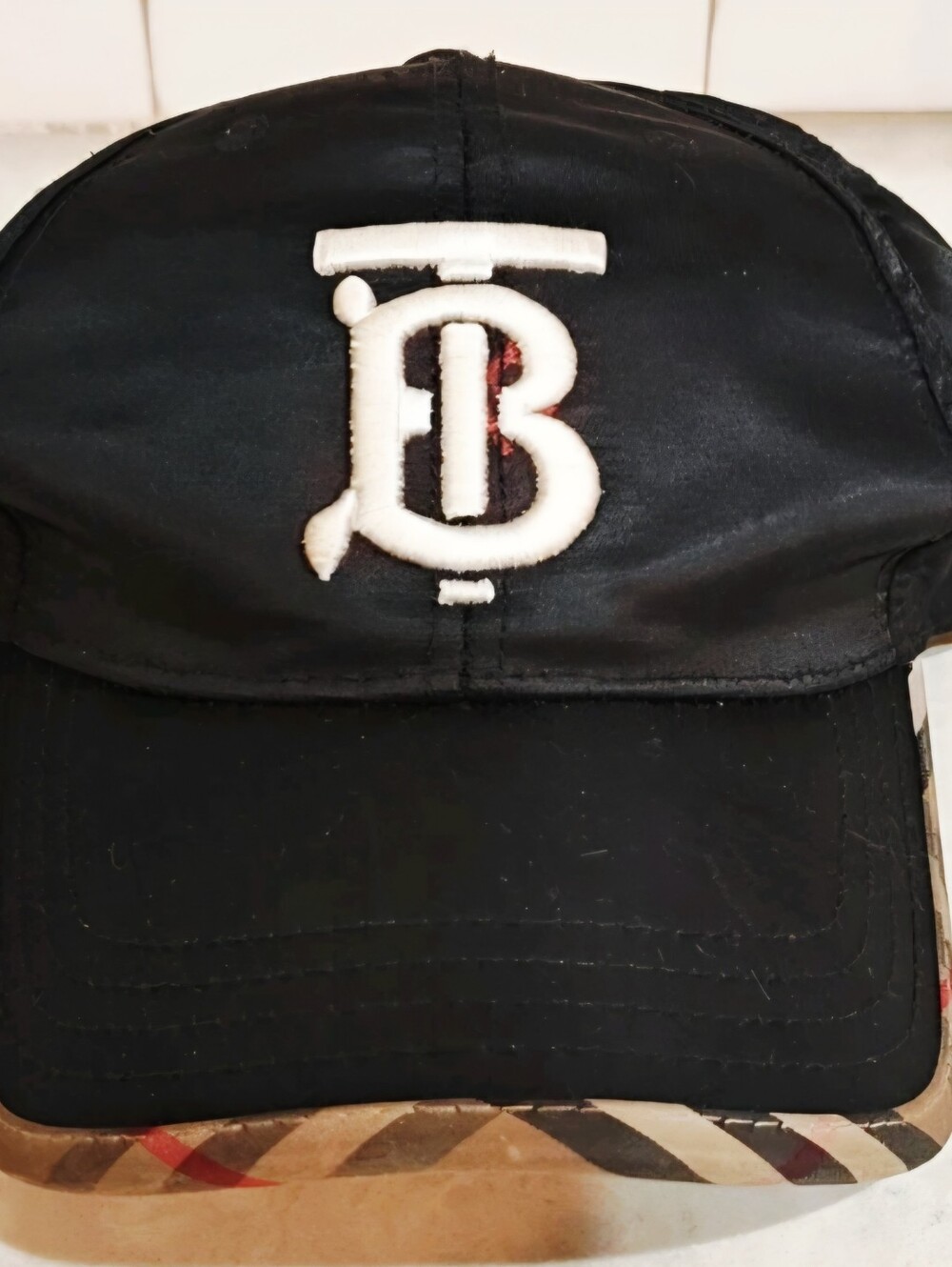 Burberry Black Cap with White Monogram and Check Trim